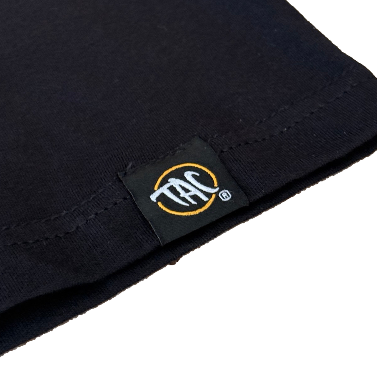 The Aloha Crew black tank top hem label detail