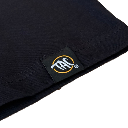 The Aloha Crew black tank top hem label detail