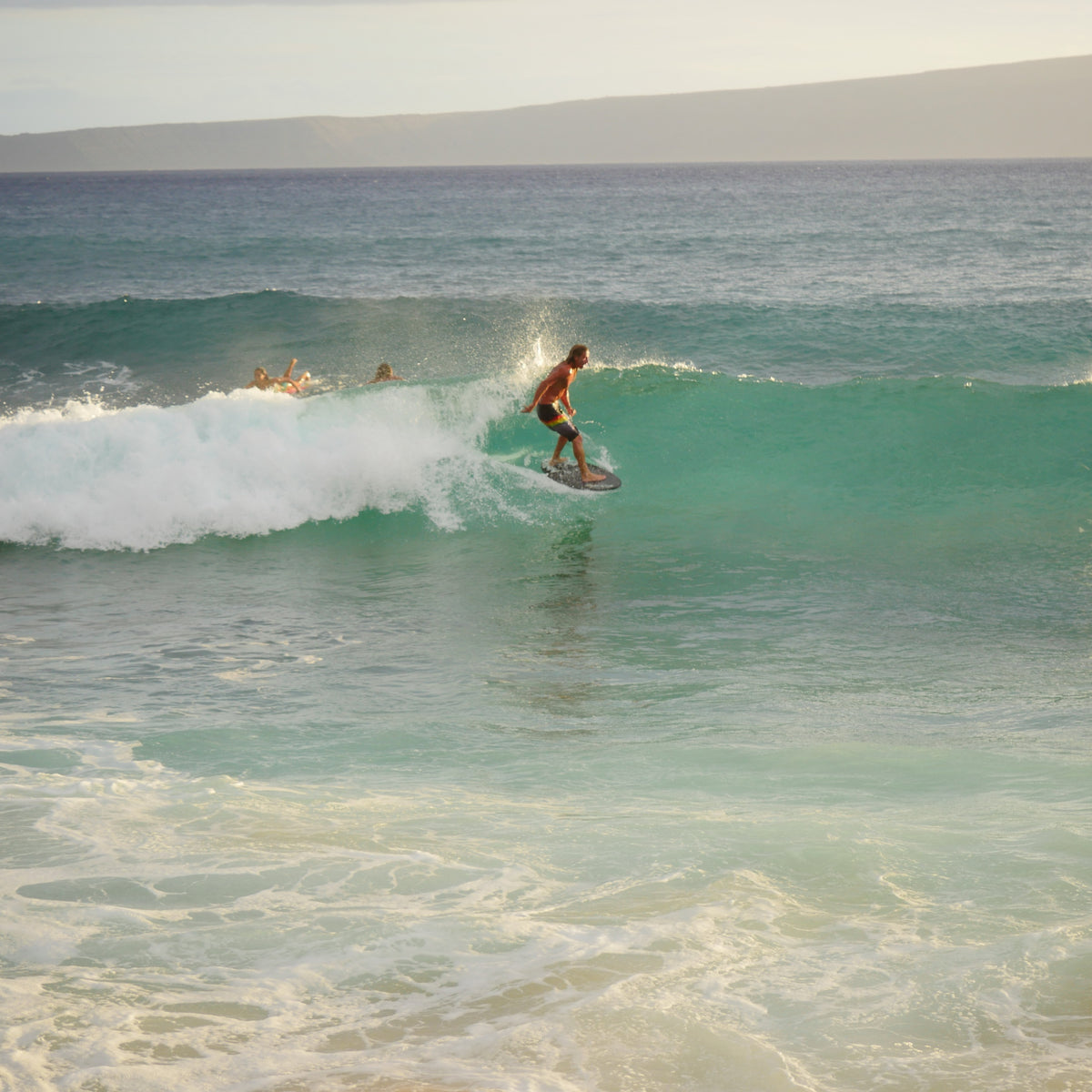Jack Klingman riding a wave on Maui