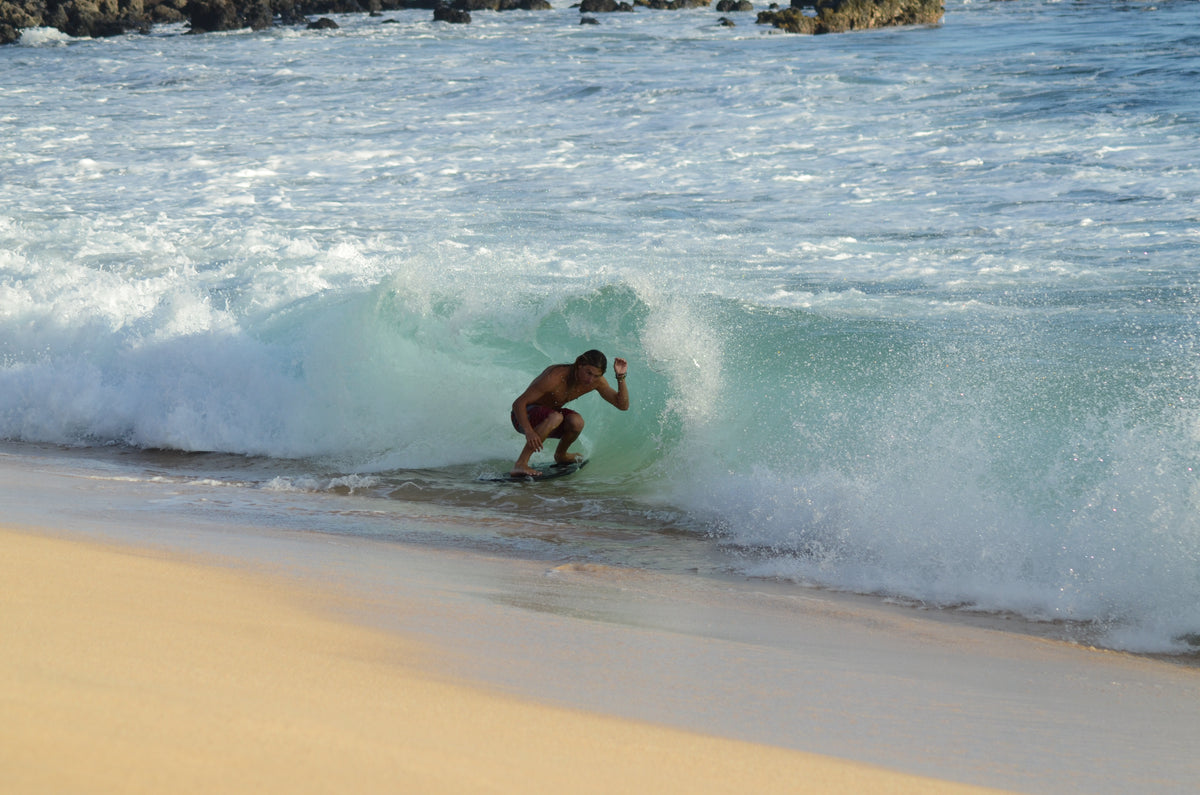 Jack Klingman riding inside a breaking wave on Maui