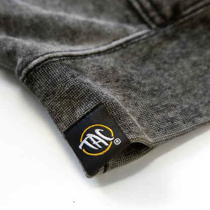 Pineapple Mineral Wash Hoodie — TAC hem label detail